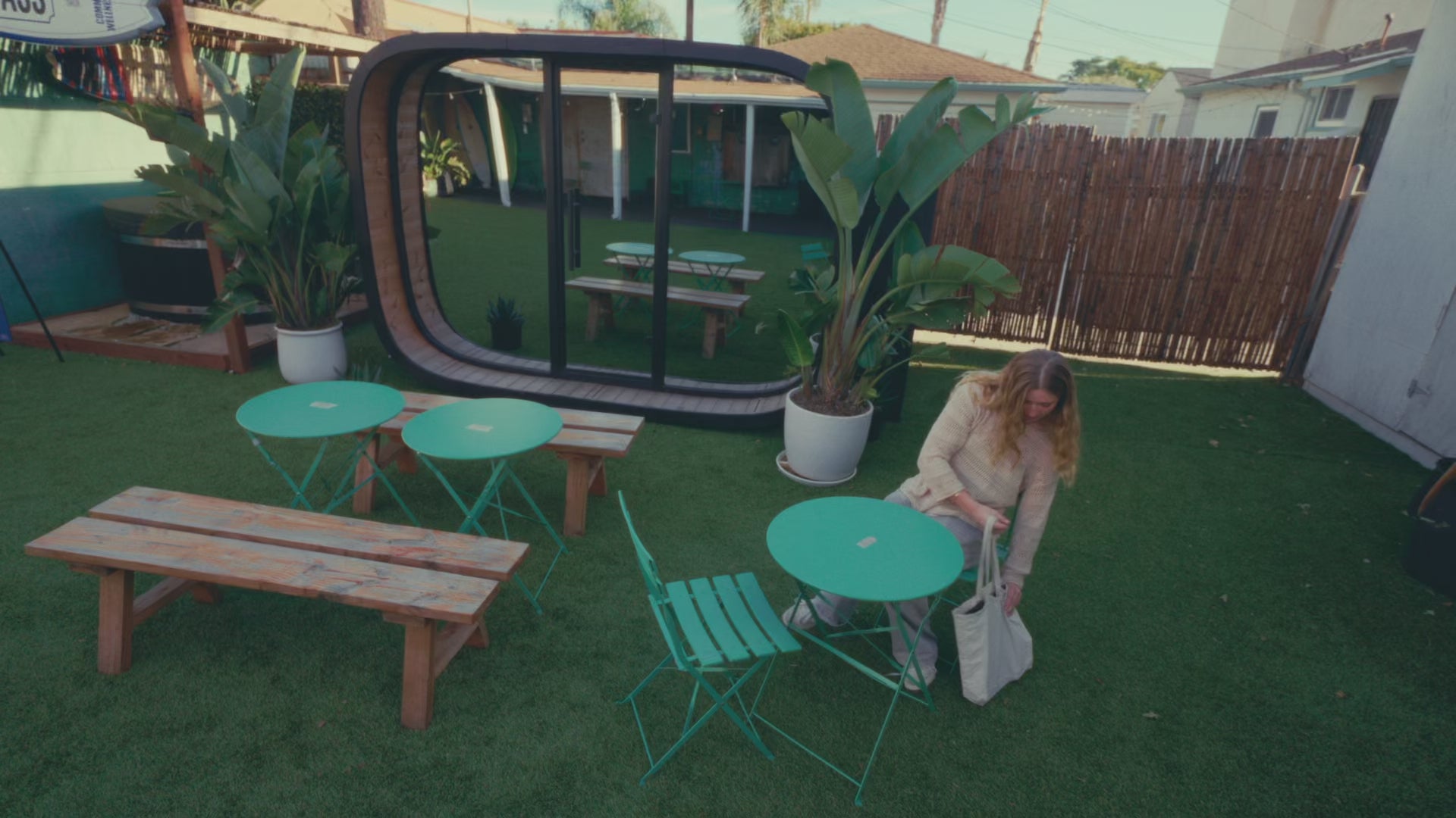 Load video: Person sits at a table and uses PodZilla with a magnetically attached ring light